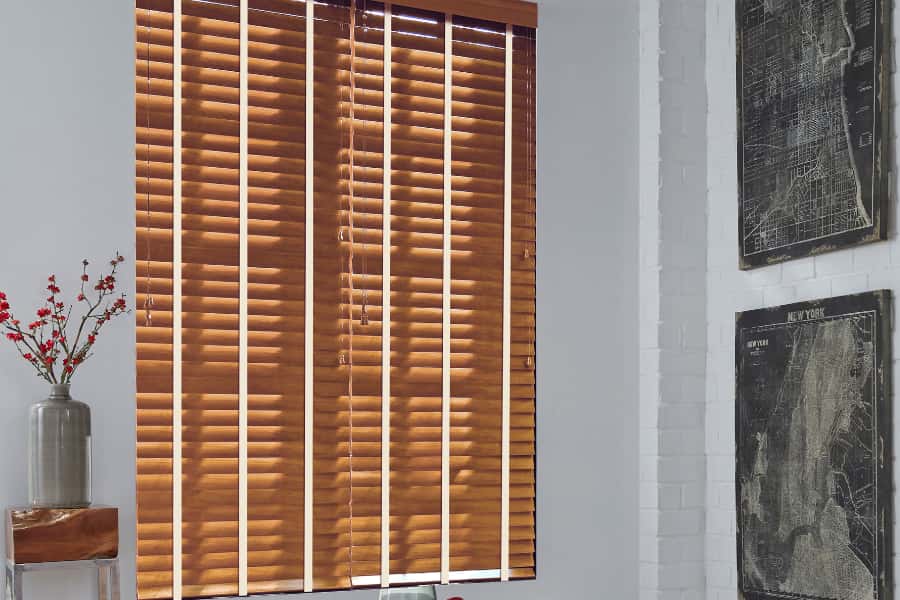 Search for the best blinds that fit well within your style and budget. Wood blinds in a small dining room area.